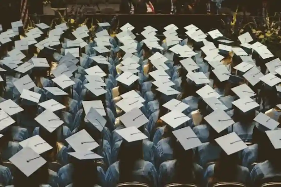 blue and white academic hats in Graduation day